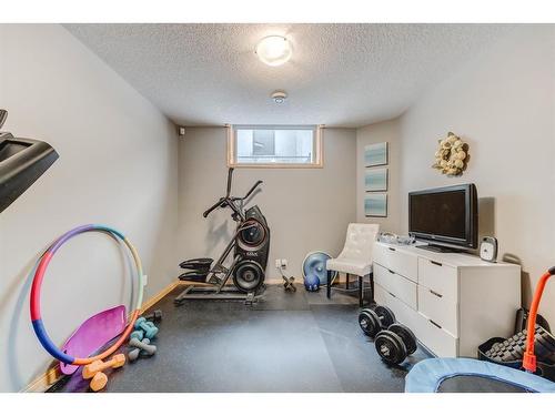 258 Arbour Vista Road Nw, Calgary, AB - Indoor Photo Showing Gym Room