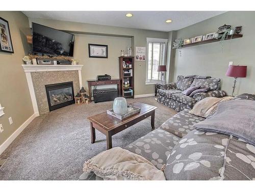 5606 28 A Avenue, Camrose, AB - Indoor Photo Showing Living Room With Fireplace
