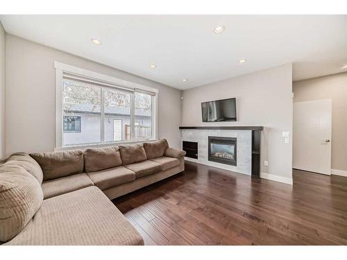 4324 70 Street Nw, Calgary, AB - Indoor Photo Showing Living Room With Fireplace