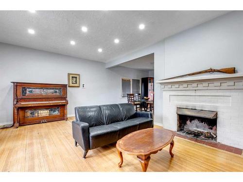 1424 Premier Way Sw, Calgary, AB - Indoor Photo Showing Living Room With Fireplace