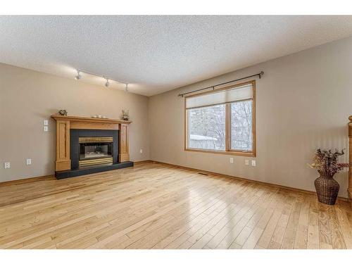 339 Citadel Hills Place Nw, Calgary, AB - Indoor Photo Showing Living Room With Fireplace