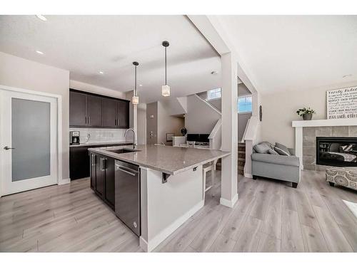 6 Legacy Glen Terrace Se, Calgary, AB - Indoor Photo Showing Kitchen With Fireplace