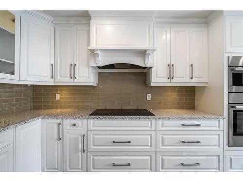 31 Bridleridge Green Sw, Calgary, AB - Indoor Photo Showing Kitchen With Upgraded Kitchen