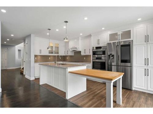 31 Bridleridge Green Sw, Calgary, AB - Indoor Photo Showing Kitchen With Upgraded Kitchen