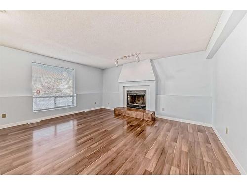 164 Sanderling Close Nw, Calgary, AB - Indoor Photo Showing Living Room With Fireplace