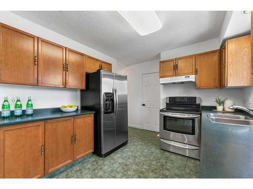 12 Cedardale Crescent Sw, Calgary, AB - Indoor Photo Showing Kitchen With Double Sink