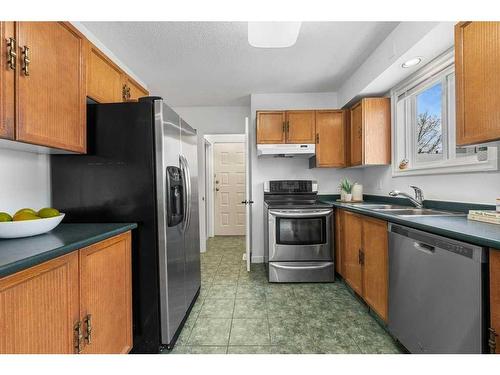 12 Cedardale Crescent Sw, Calgary, AB - Indoor Photo Showing Kitchen With Double Sink