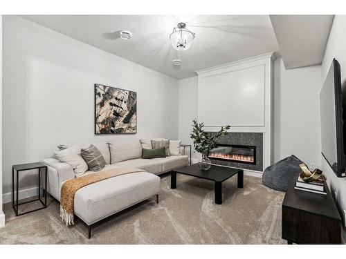 333 Bessborough Drive Sw, Calgary, AB - Indoor Photo Showing Living Room With Fireplace