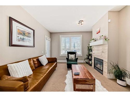 202-518 33 Street Nw, Calgary, AB - Indoor Photo Showing Living Room With Fireplace
