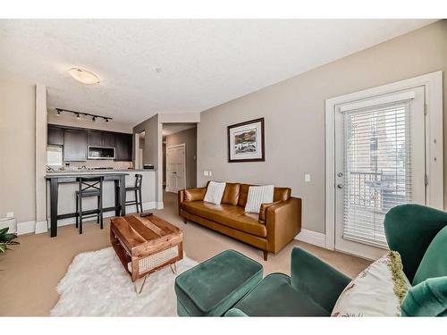 202-518 33 Street Nw, Calgary, AB - Indoor Photo Showing Living Room