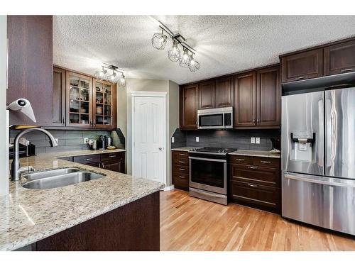 48 Arbour Crest Court Nw, Calgary, AB - Indoor Photo Showing Kitchen With Double Sink