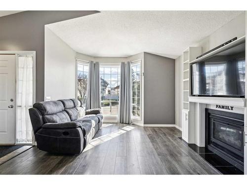 33 Martinridge Road Ne, Calgary, AB - Indoor Photo Showing Living Room With Fireplace
