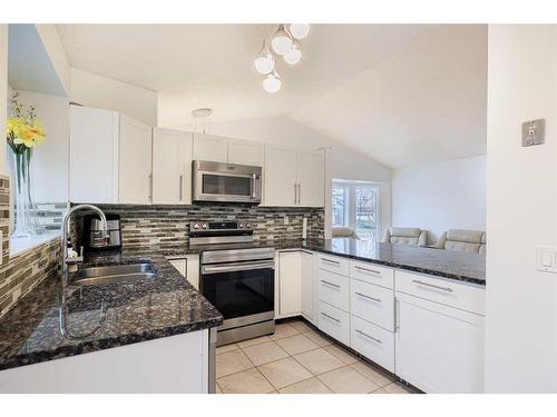 76 Riverbrook Way Se, Calgary, AB - Indoor Photo Showing Kitchen With Double Sink With Upgraded Kitchen