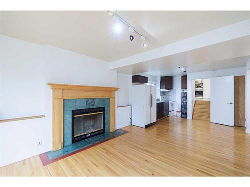 76 Riverbrook Way Se, Calgary, AB - Indoor Photo Showing Living Room With Fireplace