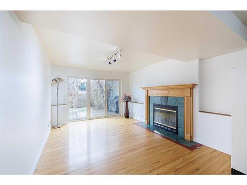 76 Riverbrook Way Se, Calgary, AB - Indoor Photo Showing Living Room With Fireplace