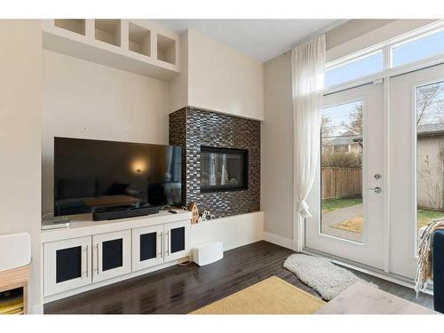 2422 Bowness Road Nw, Calgary, AB - Indoor Photo Showing Other Room With Fireplace
