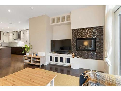2422 Bowness Road Nw, Calgary, AB - Indoor Photo Showing Living Room With Fireplace