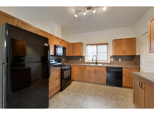 805-281 Cougar Ridge Drive Sw, Calgary, AB - Indoor Photo Showing Kitchen With Double Sink