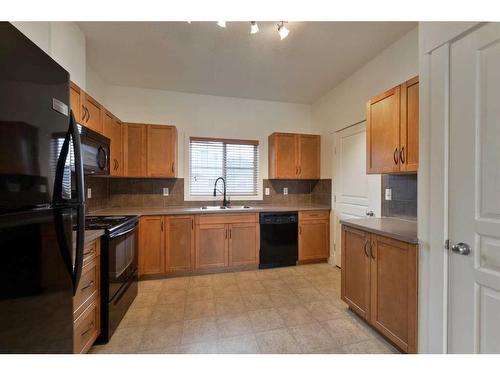 805-281 Cougar Ridge Drive Sw, Calgary, AB - Indoor Photo Showing Kitchen With Double Sink