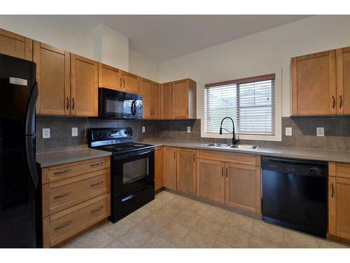 805-281 Cougar Ridge Drive Sw, Calgary, AB - Indoor Photo Showing Kitchen With Double Sink