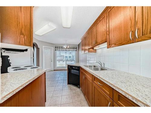 1011 Sierra Morena Park Sw, Calgary, AB - Indoor Photo Showing Kitchen With Double Sink