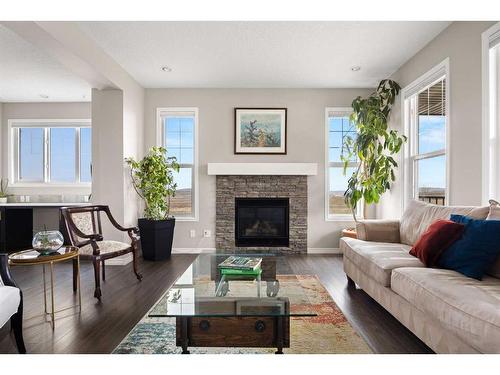 4 Heritage Boulevard, Cochrane, AB - Indoor Photo Showing Living Room With Fireplace