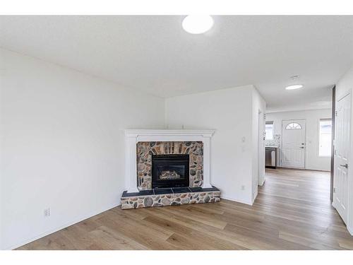 133 Taravista Crescent Ne, Calgary, AB - Indoor Photo Showing Living Room With Fireplace