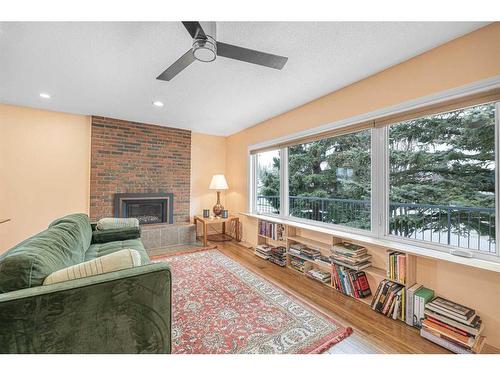 216 Silver Brook Way Nw, Calgary, AB - Indoor Photo Showing Living Room With Fireplace