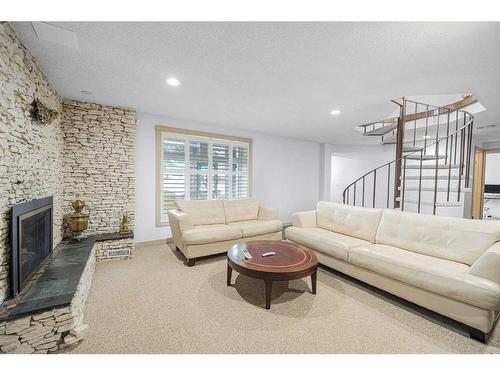 216 Silver Brook Way Nw, Calgary, AB - Indoor Photo Showing Living Room With Fireplace