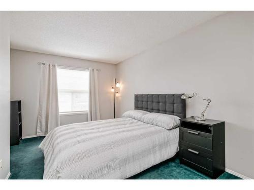 64 Chaparral Ridge Circle Se, Calgary, AB - Indoor Photo Showing Bedroom