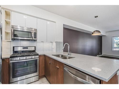 207-120 18 Avenue Sw, Calgary, AB - Indoor Photo Showing Kitchen With Stainless Steel Kitchen With Double Sink With Upgraded Kitchen