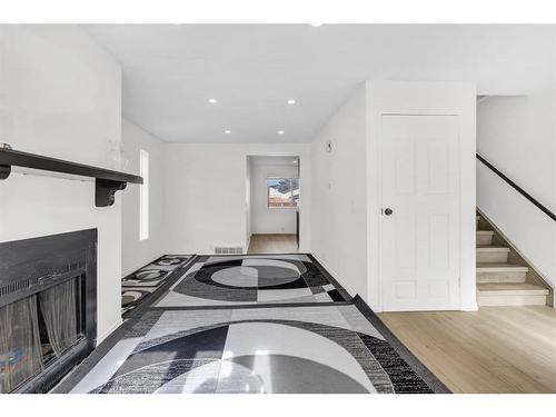 20 Falshire Way Ne, Calgary, AB - Indoor Photo Showing Other Room With Fireplace