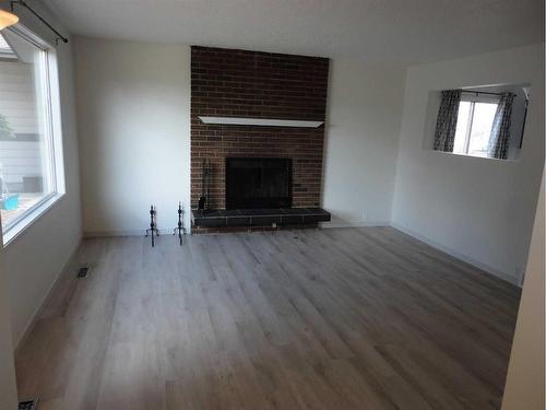 31 Dovely Way Se, Calgary, AB - Indoor Photo Showing Living Room With Fireplace