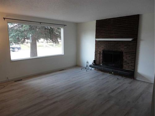 31 Dovely Way Se, Calgary, AB - Indoor Photo Showing Living Room With Fireplace