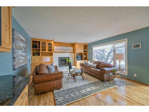 128 Edgeridge Place Nw, Calgary, AB - Indoor Photo Showing Living Room With Fireplace