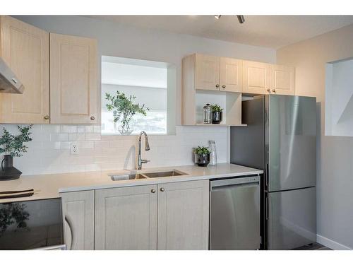 916-7038 16 Avenue Se, Calgary, AB - Indoor Photo Showing Kitchen With Double Sink