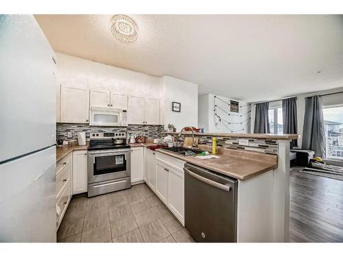 2208-1140 Taradale Drive Ne, Calgary, AB - Indoor Photo Showing Kitchen With Upgraded Kitchen