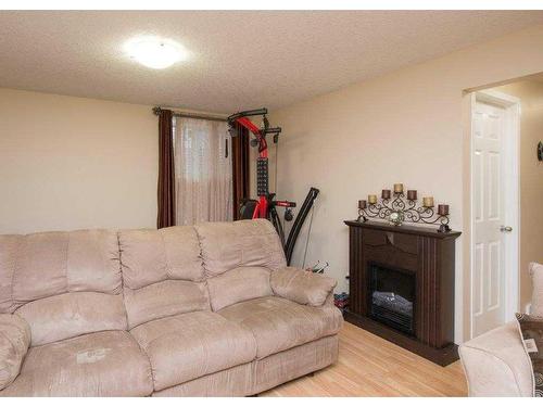 126 Silverado Plains Circle Sw, Calgary, AB - Indoor Photo Showing Living Room With Fireplace