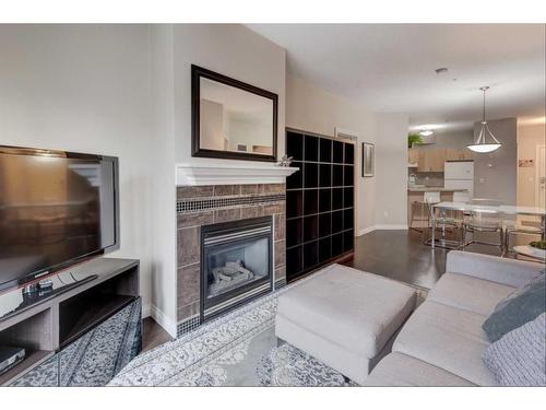 304-138 18 Avenue Se, Calgary, AB - Indoor Photo Showing Living Room With Fireplace
