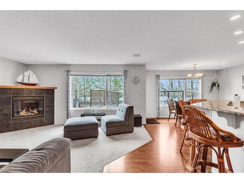 54 Chapalina Green Se, Calgary, AB - Indoor Photo Showing Living Room With Fireplace