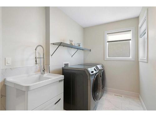 185 Carringvue Manor Nw, Calgary, AB - Indoor Photo Showing Laundry Room