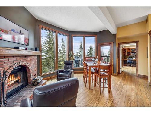 216 Coach Light Bay Sw, Calgary, AB - Indoor Photo Showing Living Room With Fireplace