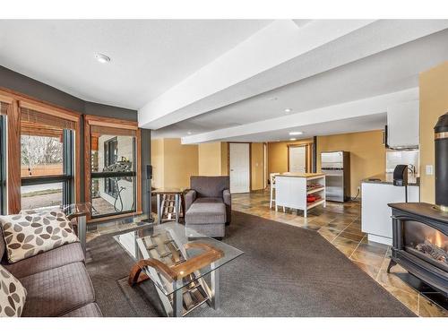 216 Coach Light Bay Sw, Calgary, AB - Indoor Photo Showing Living Room With Fireplace