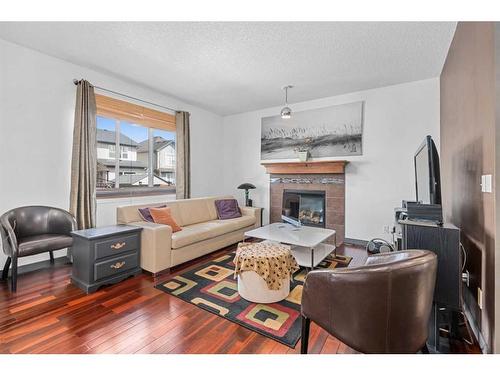 138 Silverado Creek Crescent Sw, Calgary, AB - Indoor Photo Showing Living Room With Fireplace