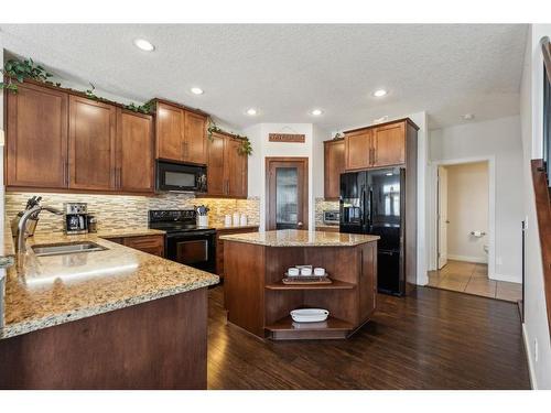 129 Heritage Hill, Cochrane, AB - Indoor Photo Showing Kitchen With Double Sink