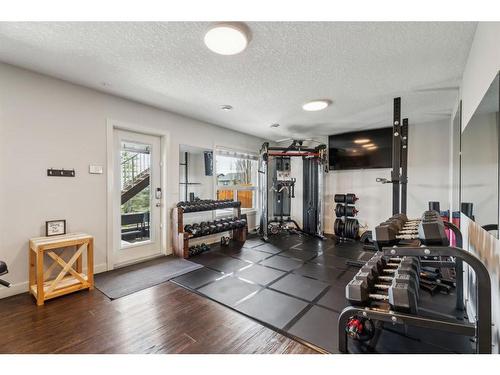 129 Heritage Hill, Cochrane, AB - Indoor Photo Showing Gym Room