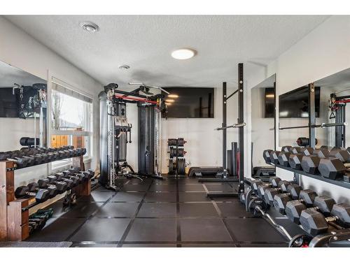 129 Heritage Hill, Cochrane, AB - Indoor Photo Showing Gym Room