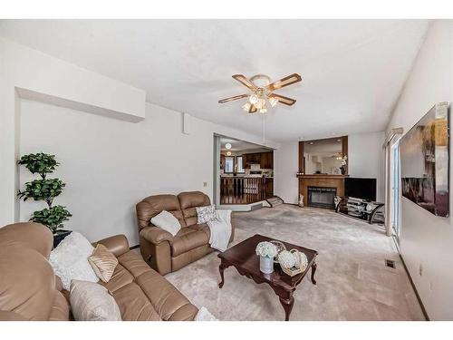3832 14 Avenue Ne, Calgary, AB - Indoor Photo Showing Living Room With Fireplace