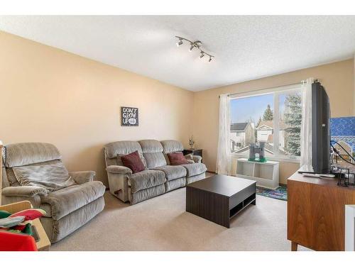 338 Mt Cornwall Circle Se, Calgary, AB - Indoor Photo Showing Living Room