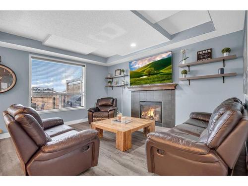 367 Prestwick Close Se, Calgary, AB - Indoor Photo Showing Living Room With Fireplace